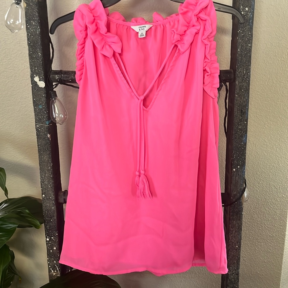 Hot pink top with ruffles around the sleeves